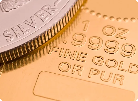 Gold and silver coins displayed side by side, highlighting their distinct colors and textures.
